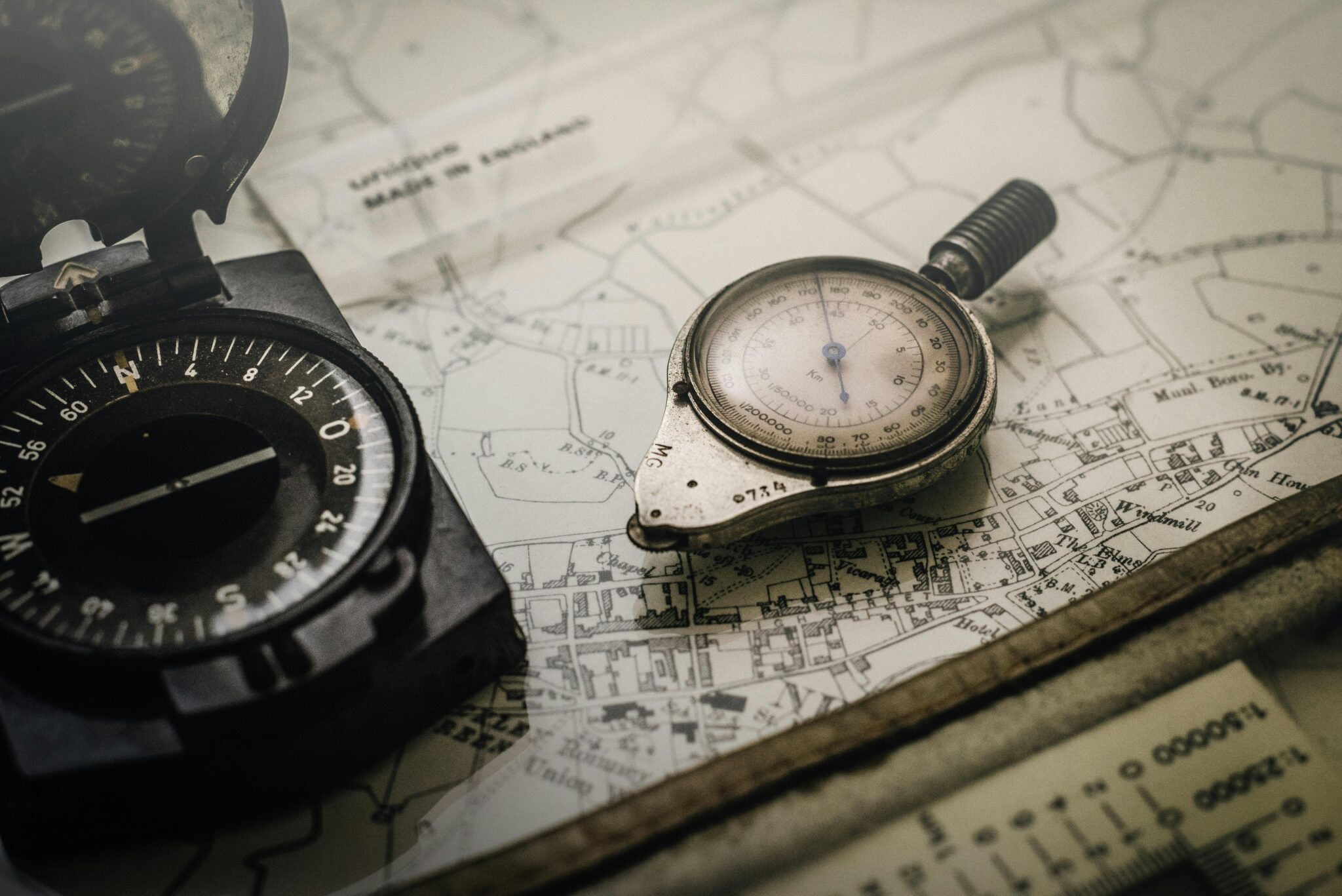 ¿Necesitas cumplir con normas AML en Colombia? Una guía simple de SAGRILAFT A vintage compass and navigation instrument on an old map, showcasing precision tools for exploration.