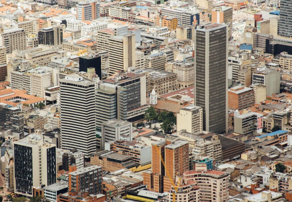 pexels photo 13823694 13823694 Aerial cityscape of downtown Bogotá featuring modern skyscrapers and urban architecture.