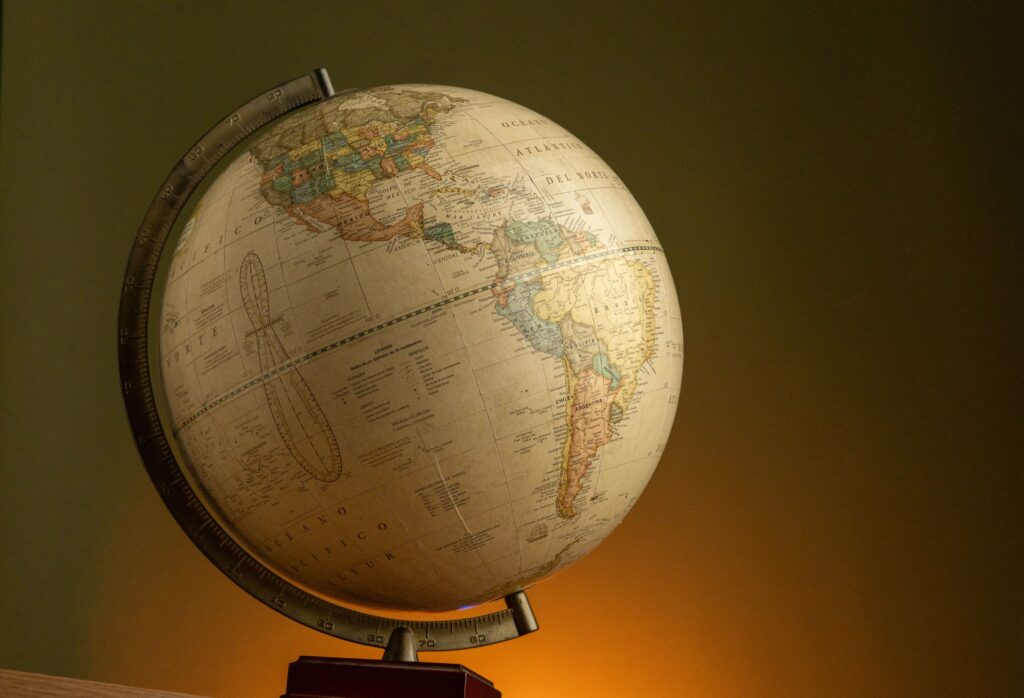 Employment Contracts in Colombia: Can You Use Your Global Agreement? Elegant vintage globe showcasing world geography with a warm ambient background.